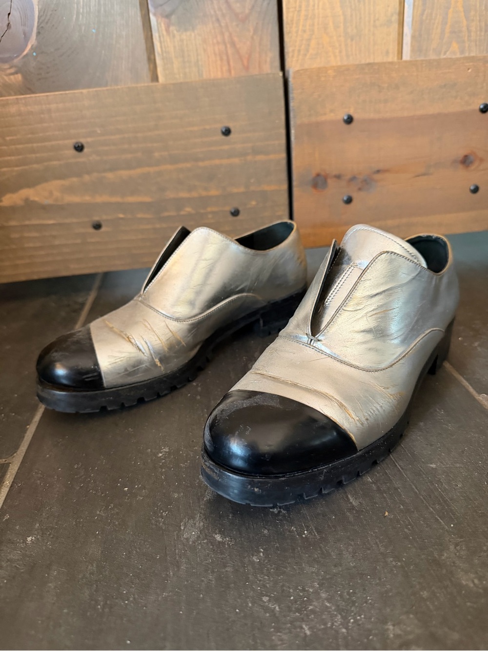 Miu Miu Metallic Silver Slip-On Loafers with Black Cap Toe